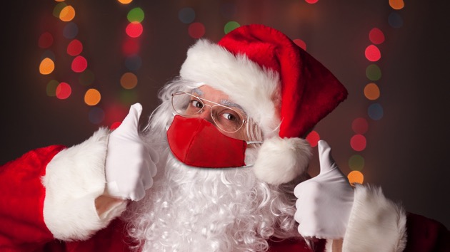 Santa Claus in Face Mask With Two Thumbs Up